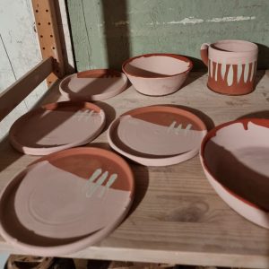 raw glazed pots ready to be fired