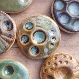 ceramic fidget stones on wooden background