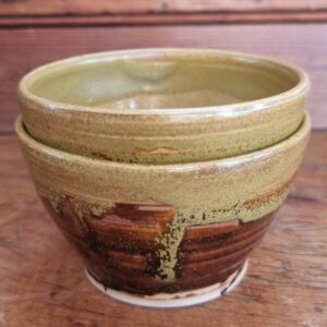 yellow and brown bowl on wooden background